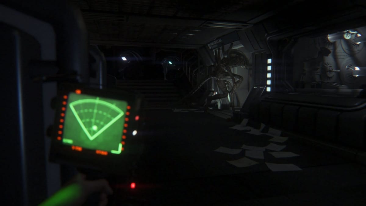 The player watches from a hiding place in Alien: Isolation.