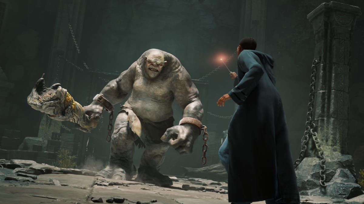 A student facing down a troll in Hogwarts Legacy