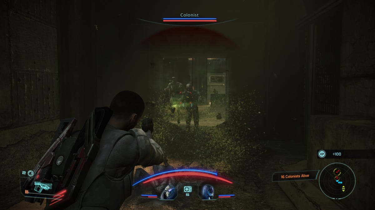 Player character shooting at husks in Mass Effect