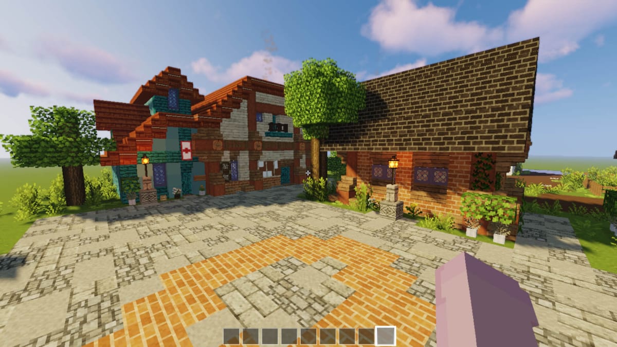 A closer look at Pierre's store and Harvey's clinic in the Minecraft recreation of Pelican Town's town square.
