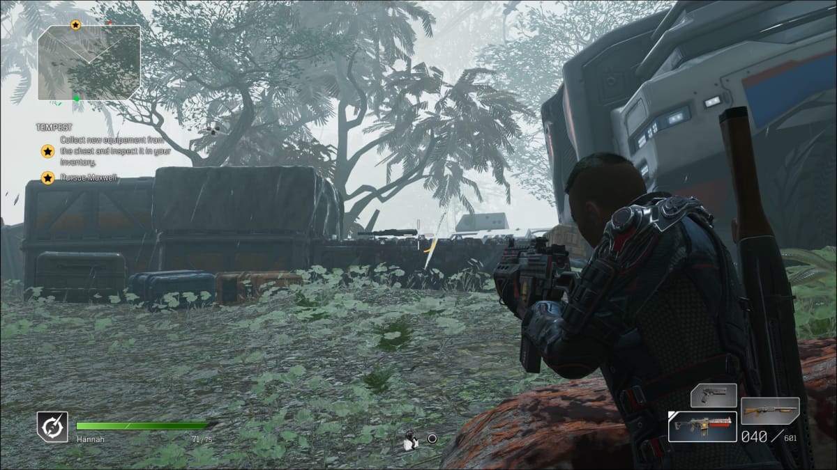 An armored soldier taking aim from cover in a forest