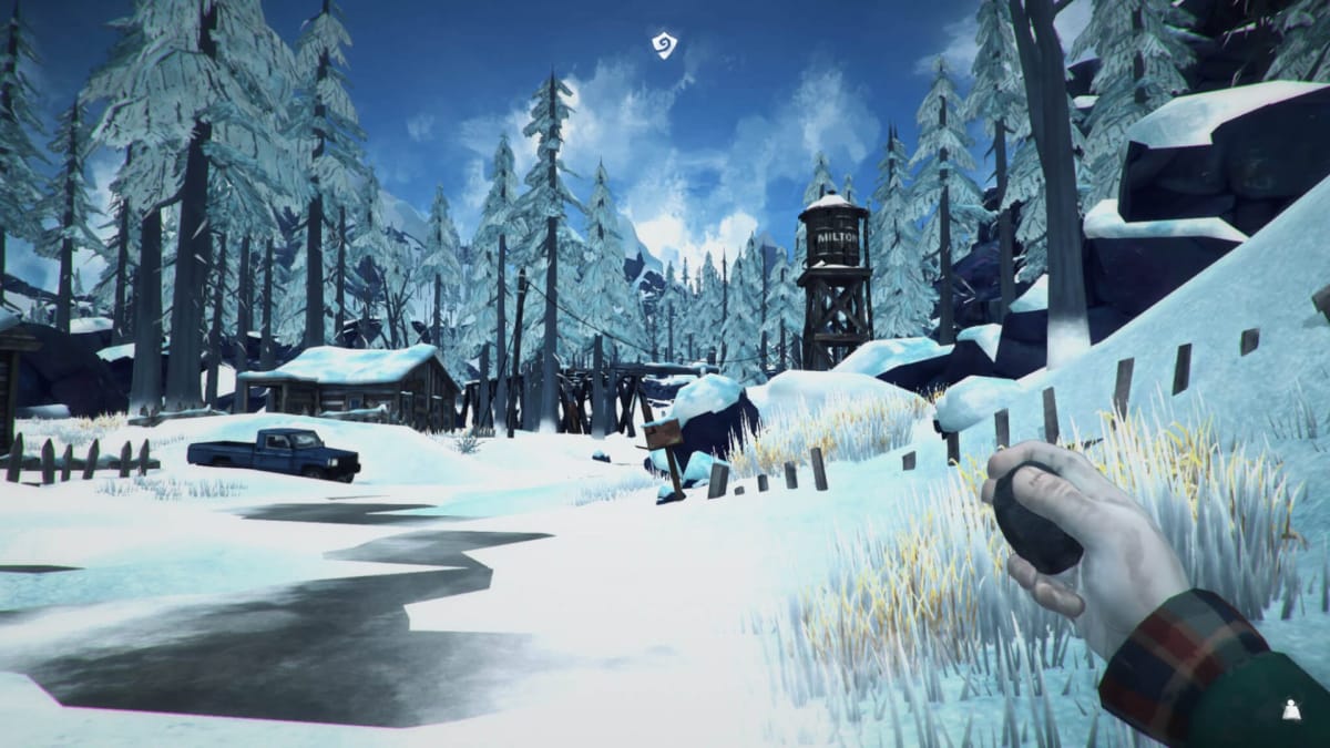 The player holding a rock in The Long Dark
