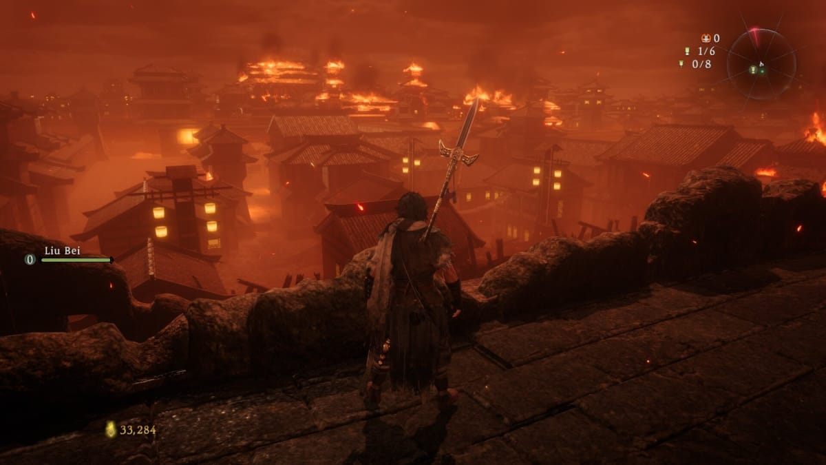 The player looking over a burning town in Wo Long: Fallen Dynasty.