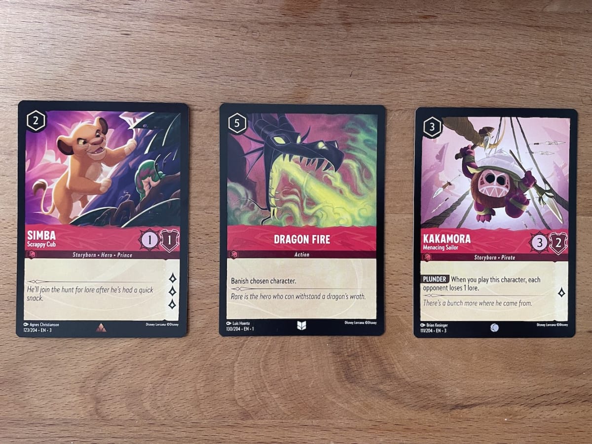 An image from our Disney Lorcana Into The Inklands Starter Deck Review featuring brash bold and aggressive Ruby cards