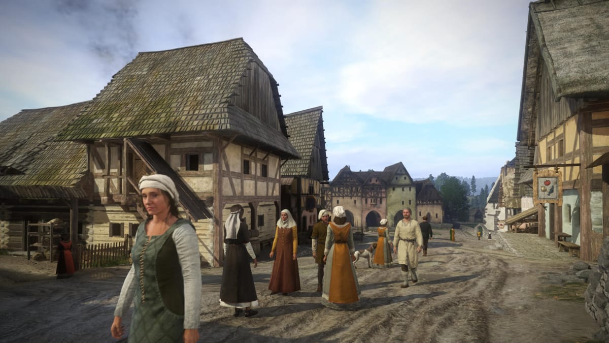 A group of villagers standing around in a street in Kingdom Come: Deliverance