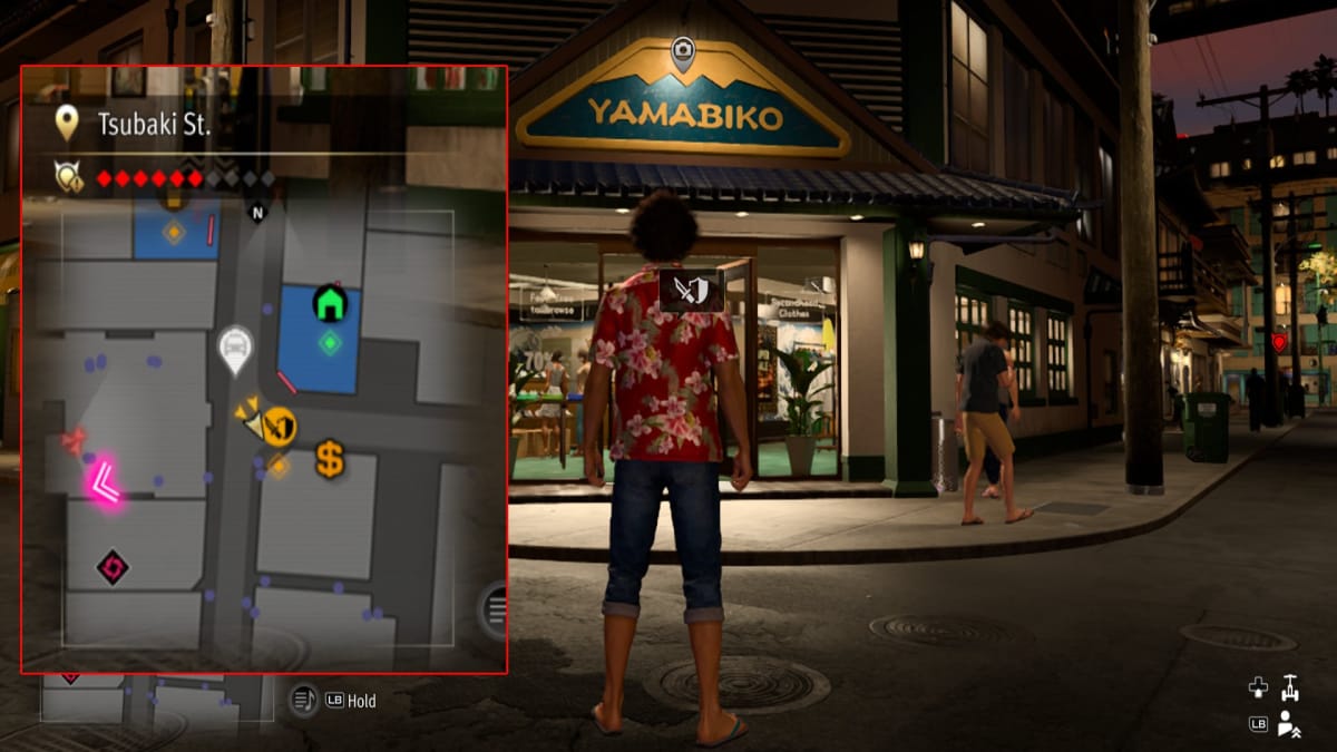 like a dragon infinite wealth screenshot showing a map reference and a store with a mountain logo over the doorway
