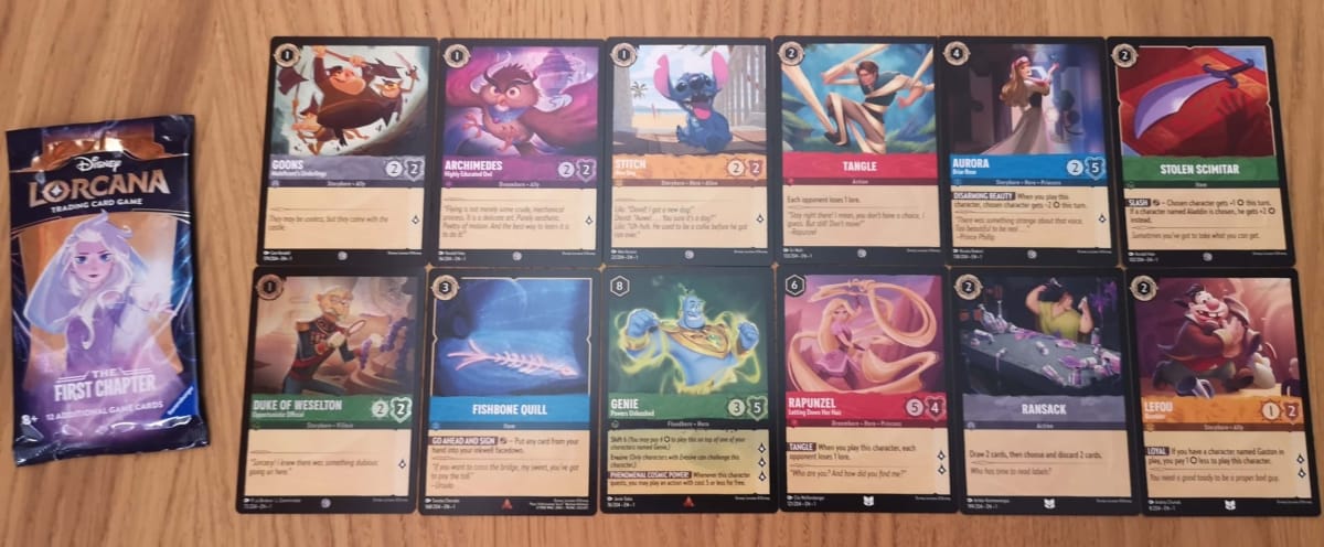 The 12 Disney Lorcana Cards in our First Chapter Booster Pack 23.
