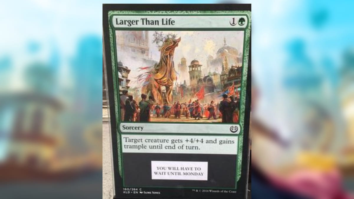 magic the gathering card in green with art depicting a giant mechanical creation towering above a crowd of people in a busy market square