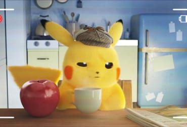 Detective Pikachu sitting at the breakfast table with an apple and a cup of coffee