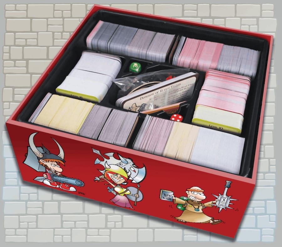 A screenshot of the inside of a copy of Munchkin Big Box, showing stacks of cards, game boards, and dice.