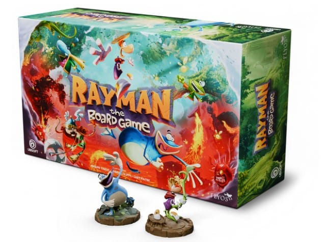 A screenshot of the box for Rayman The Board Game, two fully painted miniatures of Rayman and Globox are shown in front of the box.