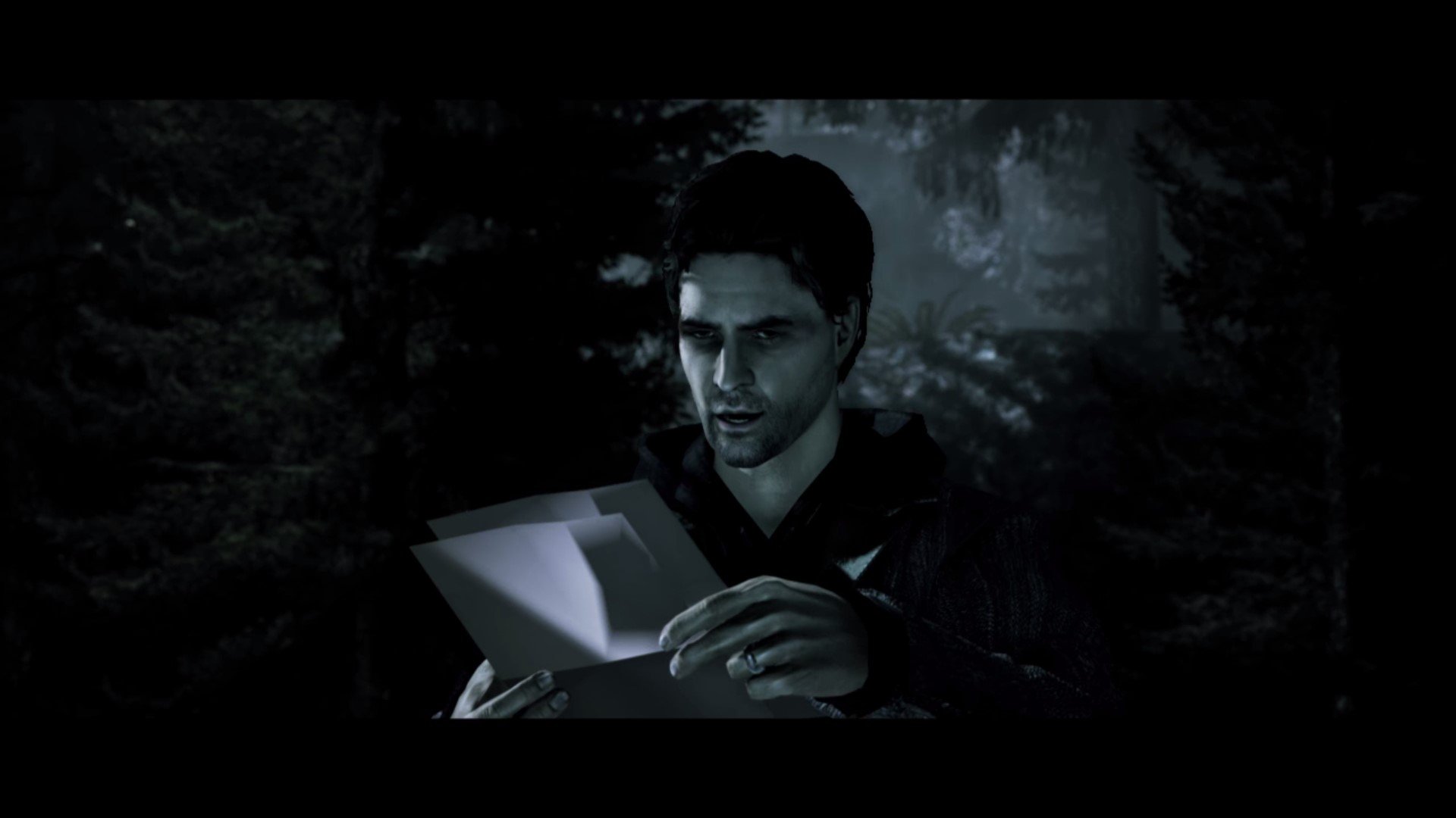 Alan Wake reading manuscript pages in the dark