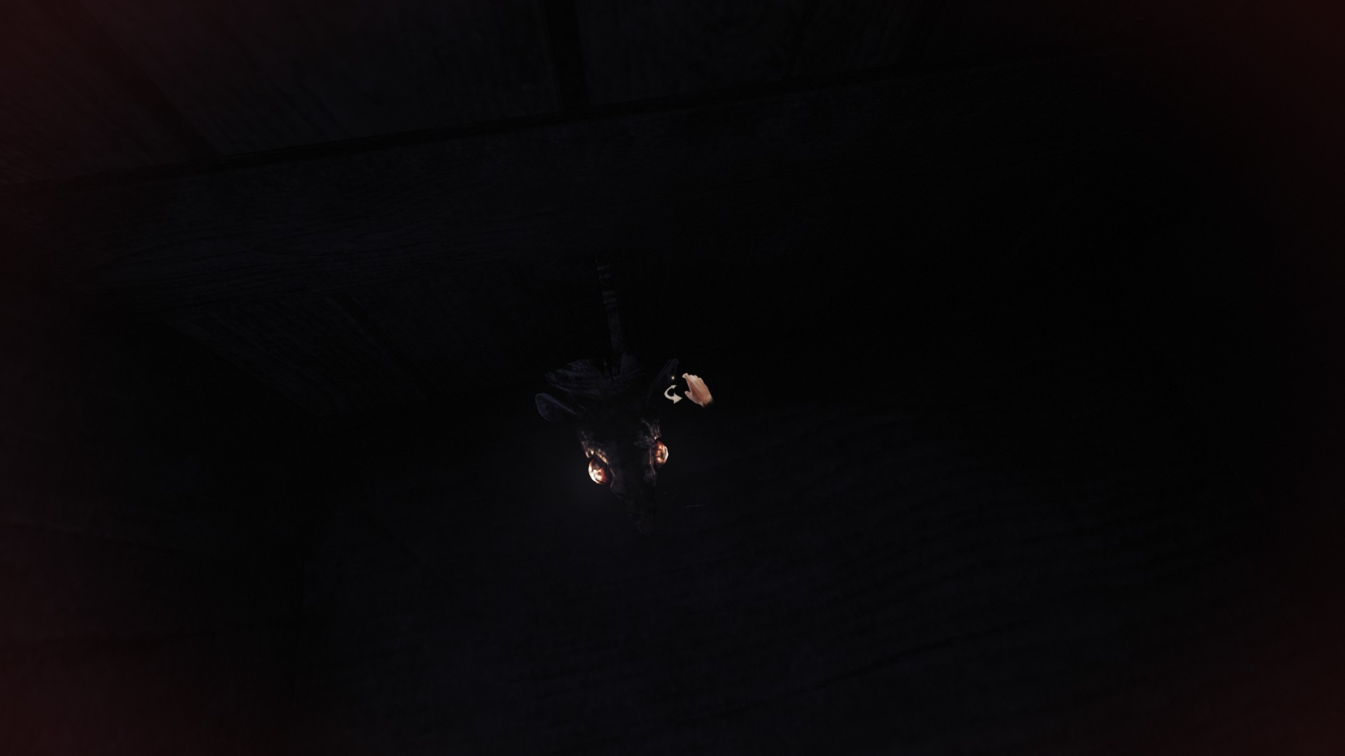 Amnesia: The Bunker screenshot showing a rat appearing to phase through a wooden cupboard door. 