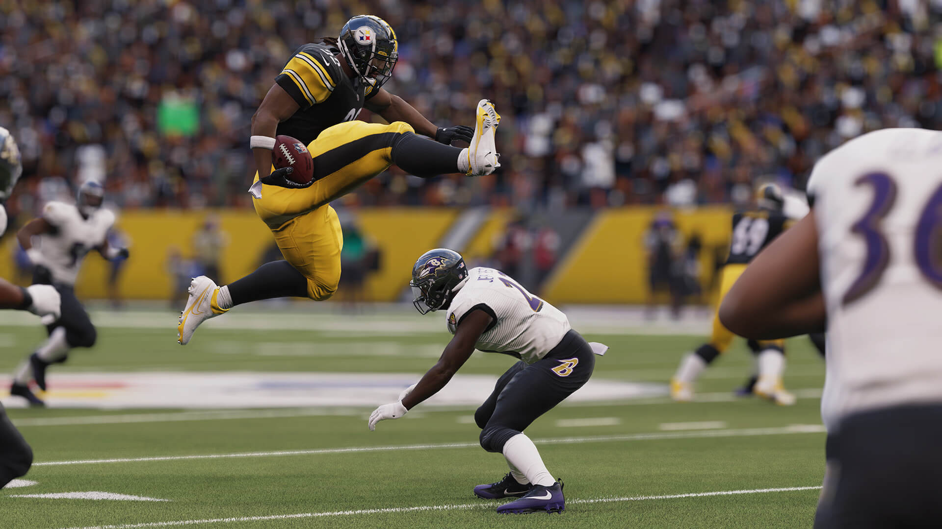 A player kicking over another player's head in Madden NFL 23, which is headed to Game Pass tomorrow