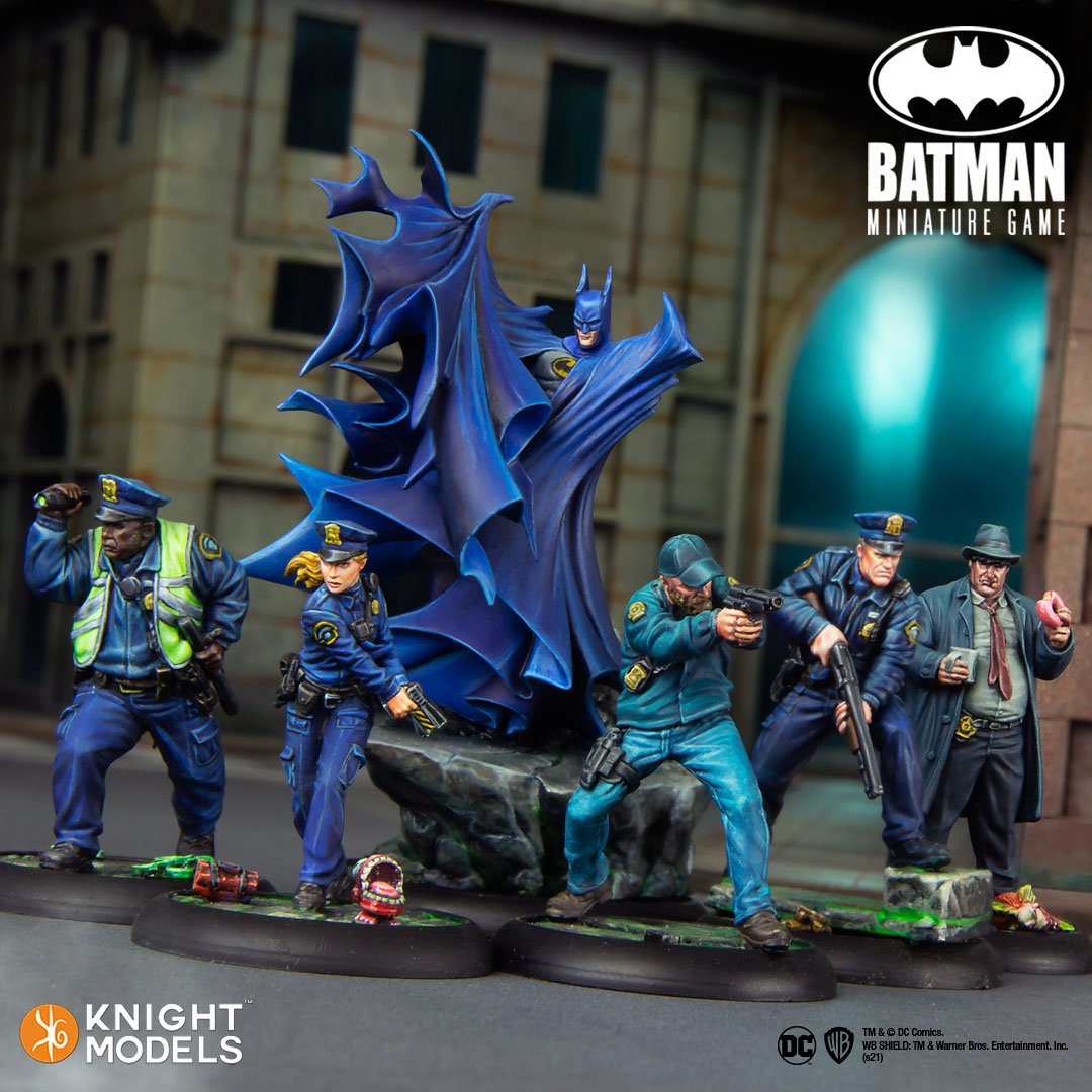 A press image of Batman with Gotham City Police as miniature models