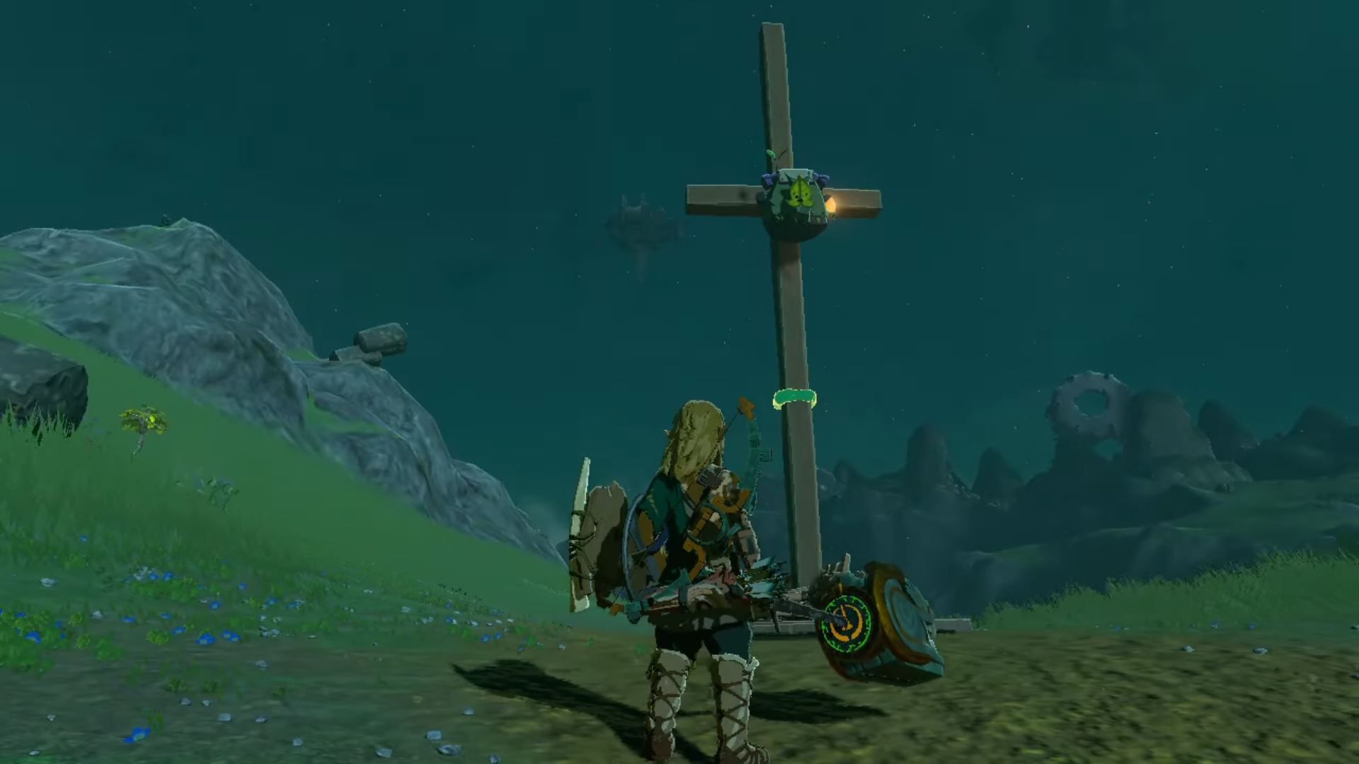 A Korok on a crucifix with Link standing in front of him in Tears of the Kingdom