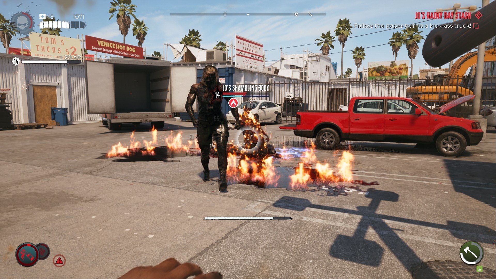 Dead Island 2 screenshot depicting several zombies walkign twowards the player with pool of burning oil strewn across the parking lot backdrop. 
