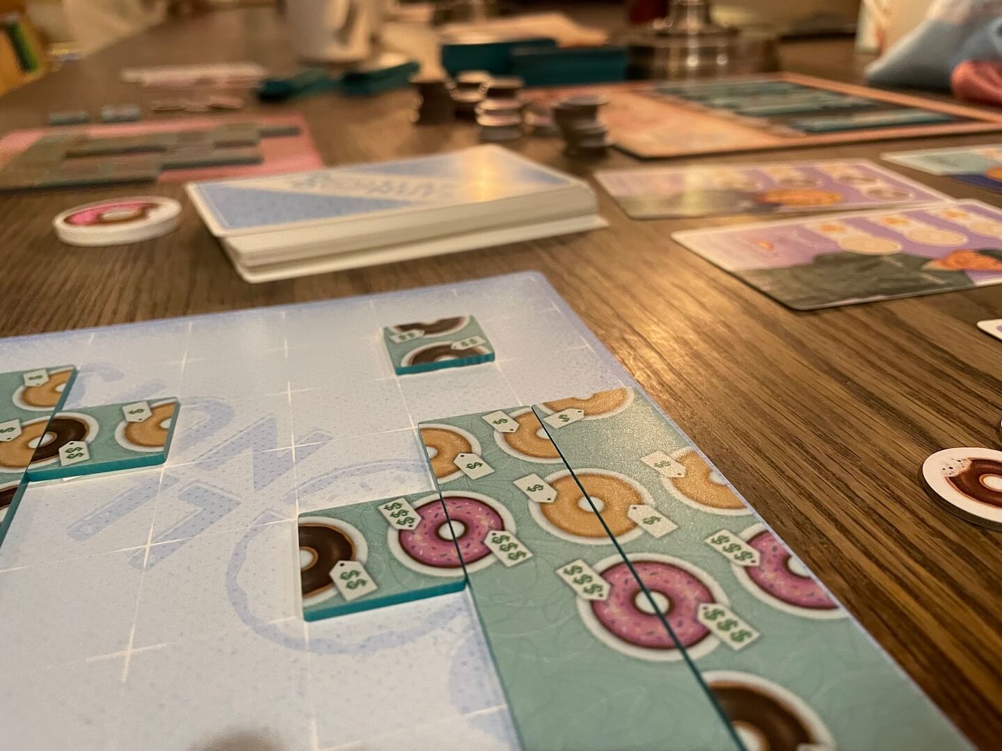 The board mid-game in Dollars To Donuts
