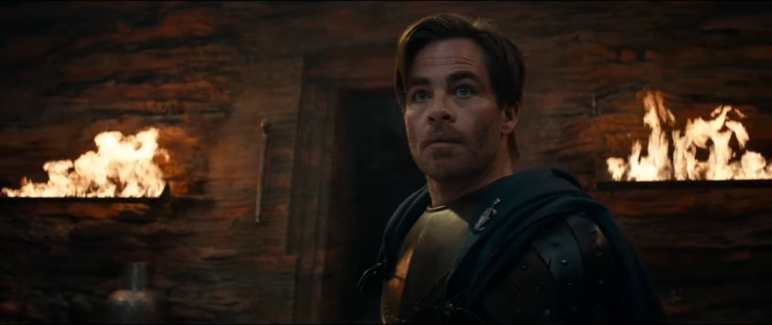 Chris Pine looking in surprise as torches and sconces self-light