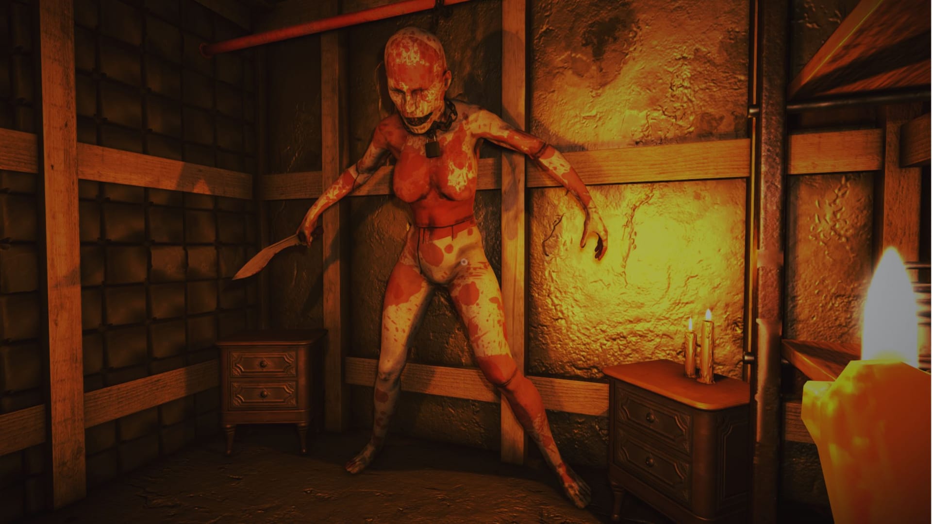 A giant, bloodied mannequin woman chained to the wall and holding a knife
