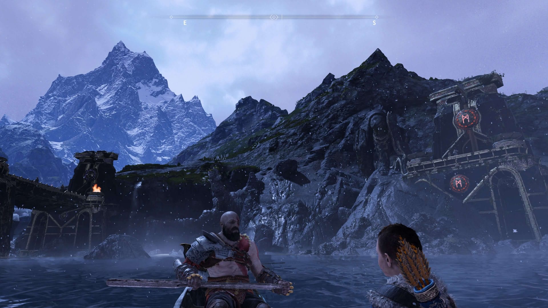 Kratos and Atreus in canoe in God of War 