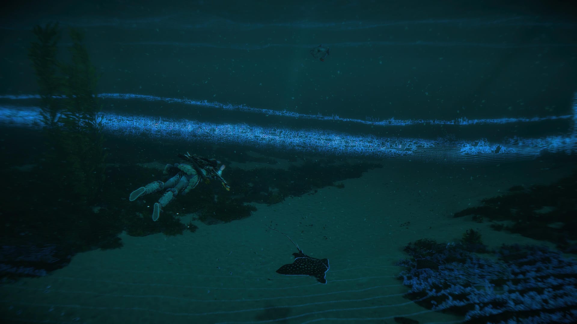 Aloy swimming with sea creatures underwater in Horizon Forbidden West