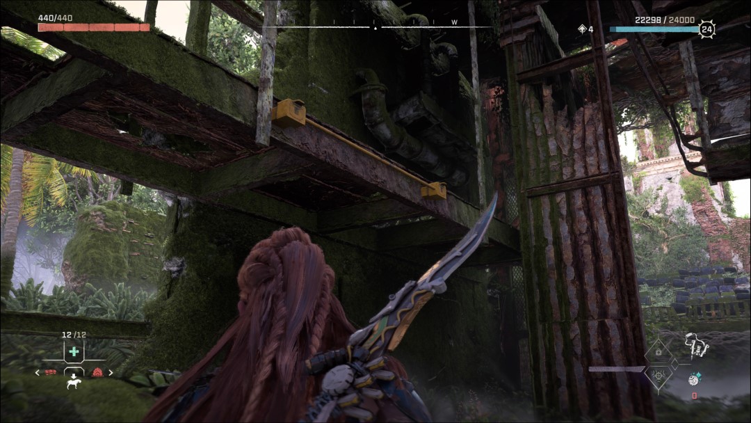 Aloy looking up to a ramp with a crate hidden above