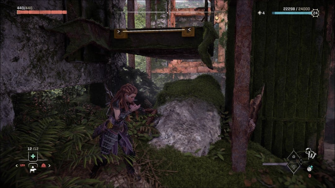 Aloy near a rusted scaffold in the The Long Coast Relic Ruin