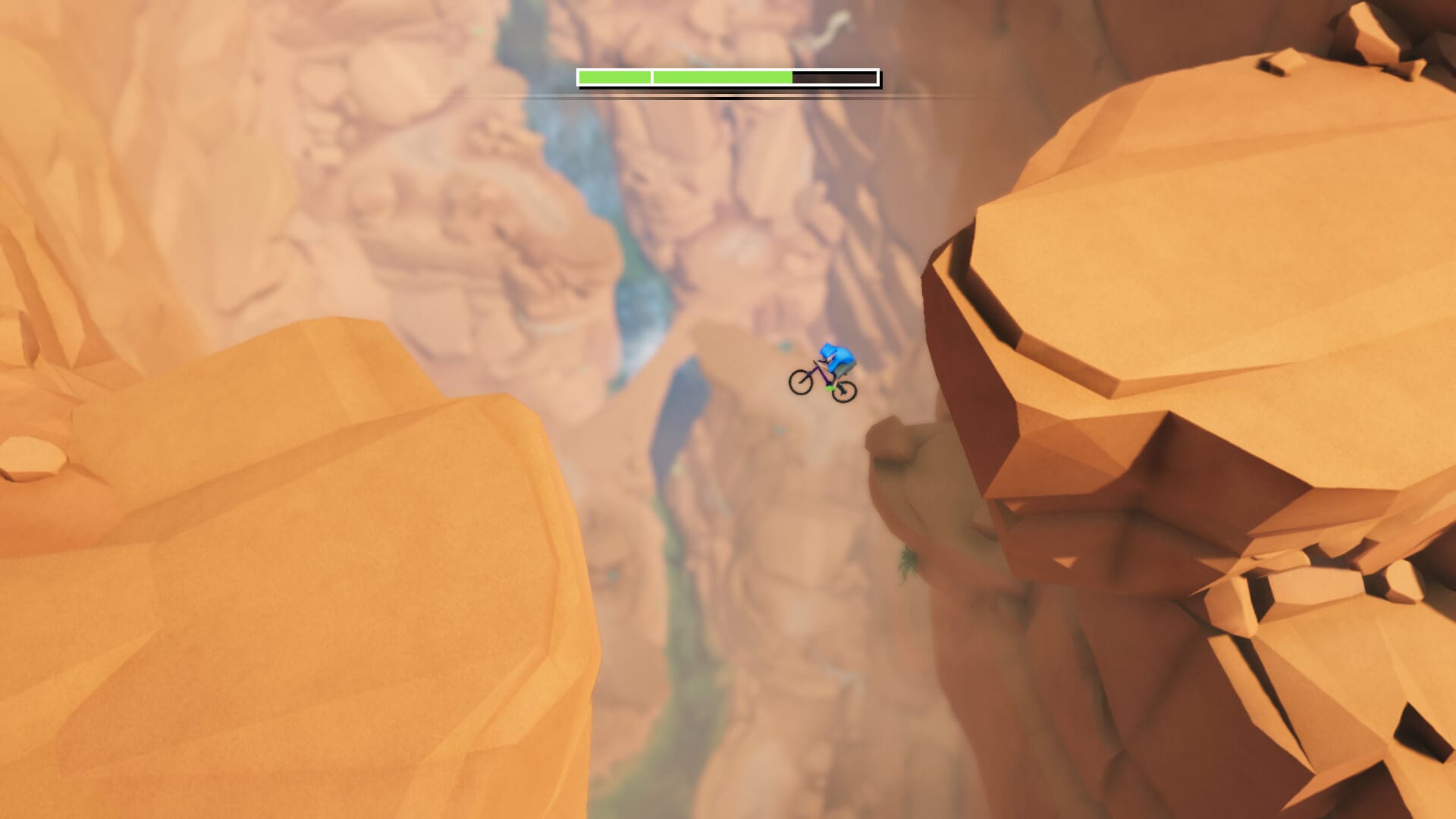 The rider jumps a desert chasm in Lonely Mountains: Downhill