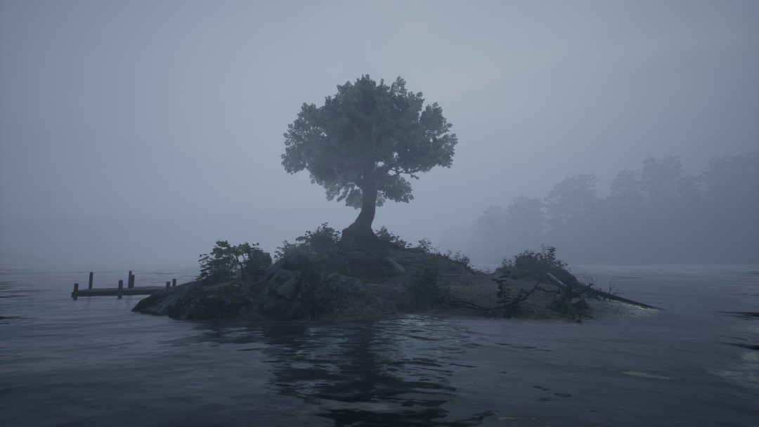 A scenic lake covered in fog
