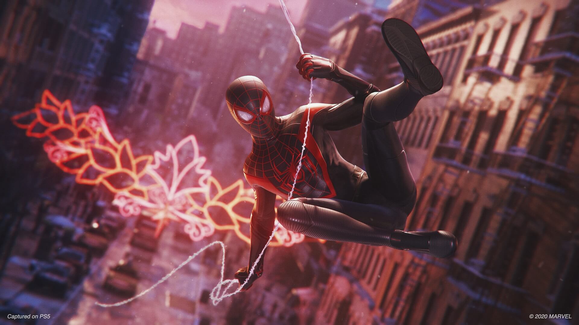 Miles Morales swinging through the city in Marvel's Spider-Man: Miles Morales on PS5