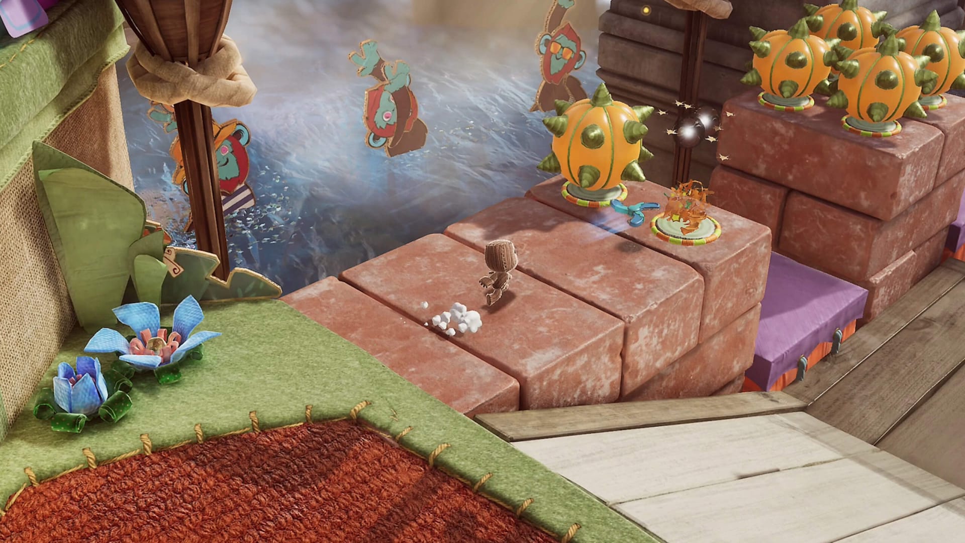 Sackboy running through a level in the PS5 game Sackboy: A Big Adventure, part of the LittleBigPlanet franchise originally created by Media Molecule