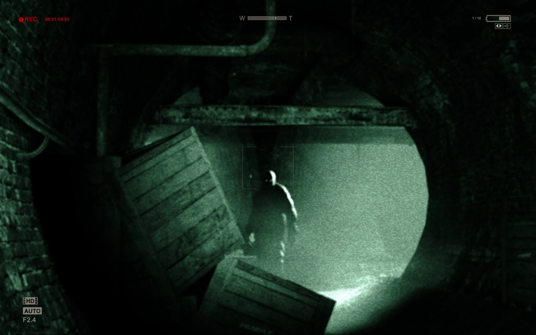 A menacing presence stands in the tunnels beneath the asylum in Outlast.