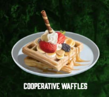An image of a stack of waffles with fruit, whipped cream, butter, and cinnamon from Pathfinder Treasure Vault