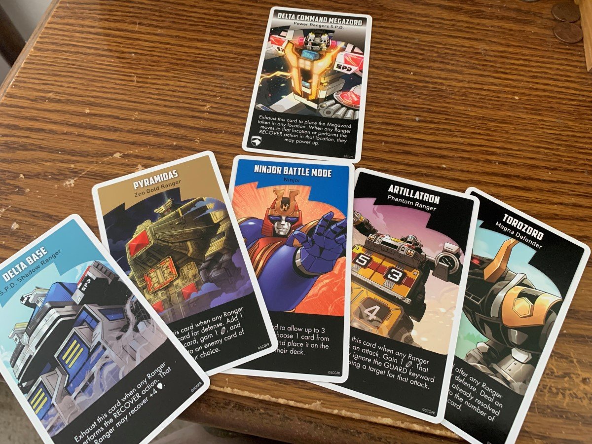 A spread of the new Zord cards from Ally Pack 1