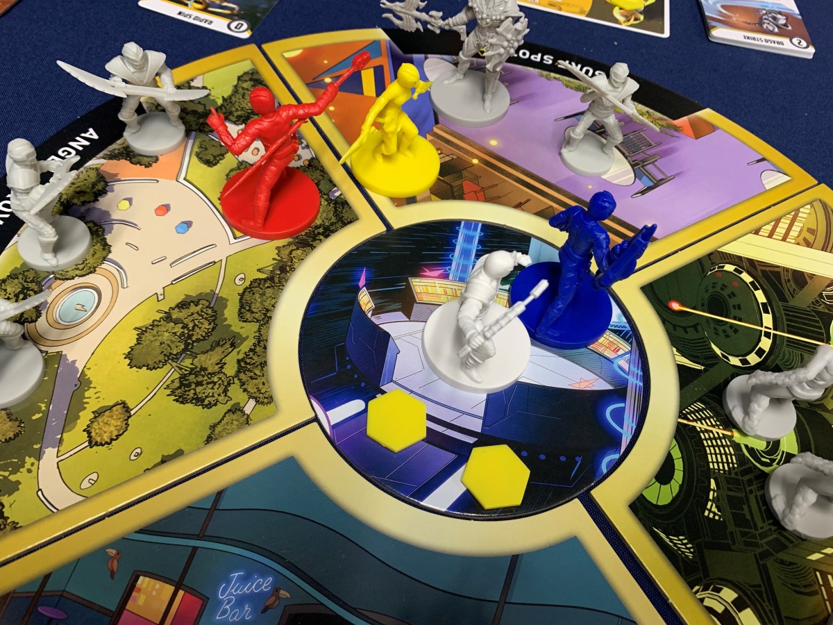A game board set up with the Dino Thunder team in play