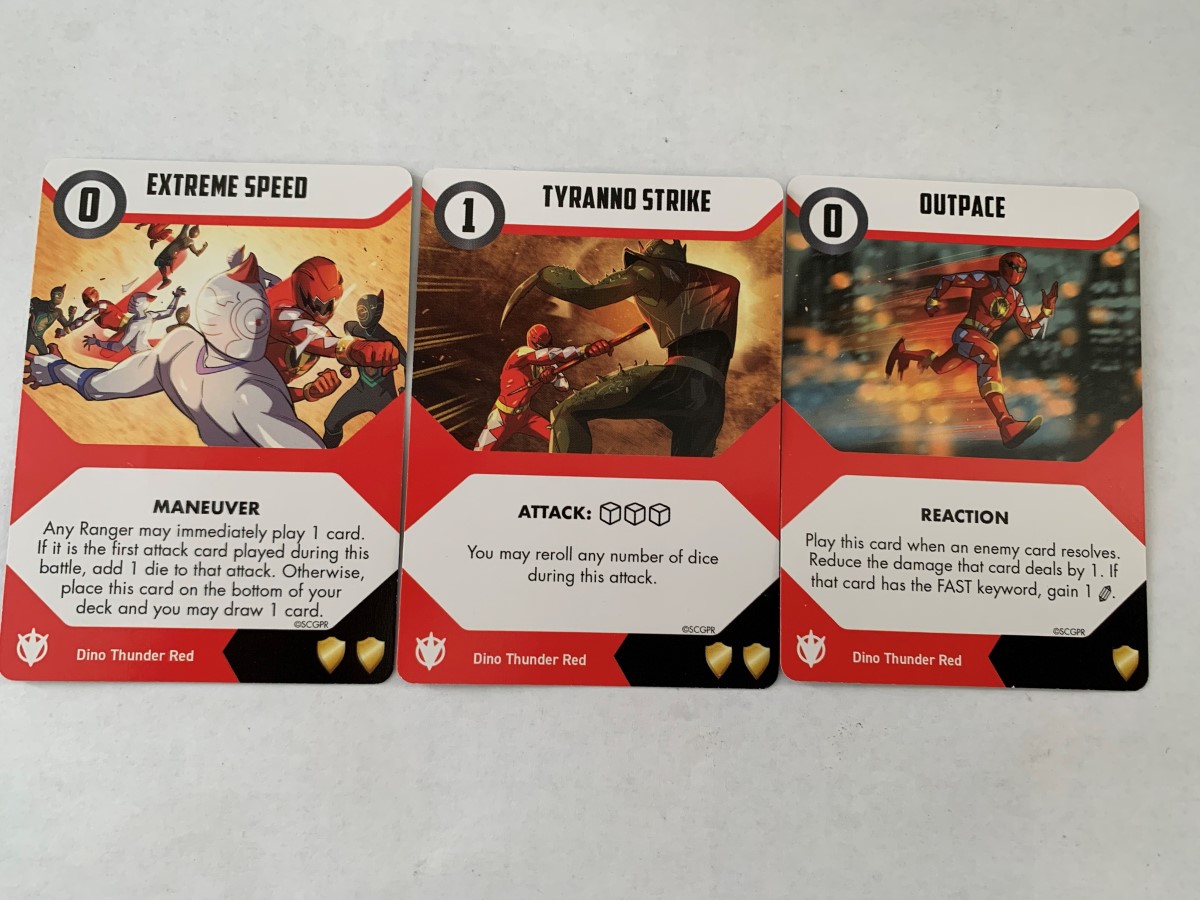 A spread of Conner's cards from the Dino Thunder Pack