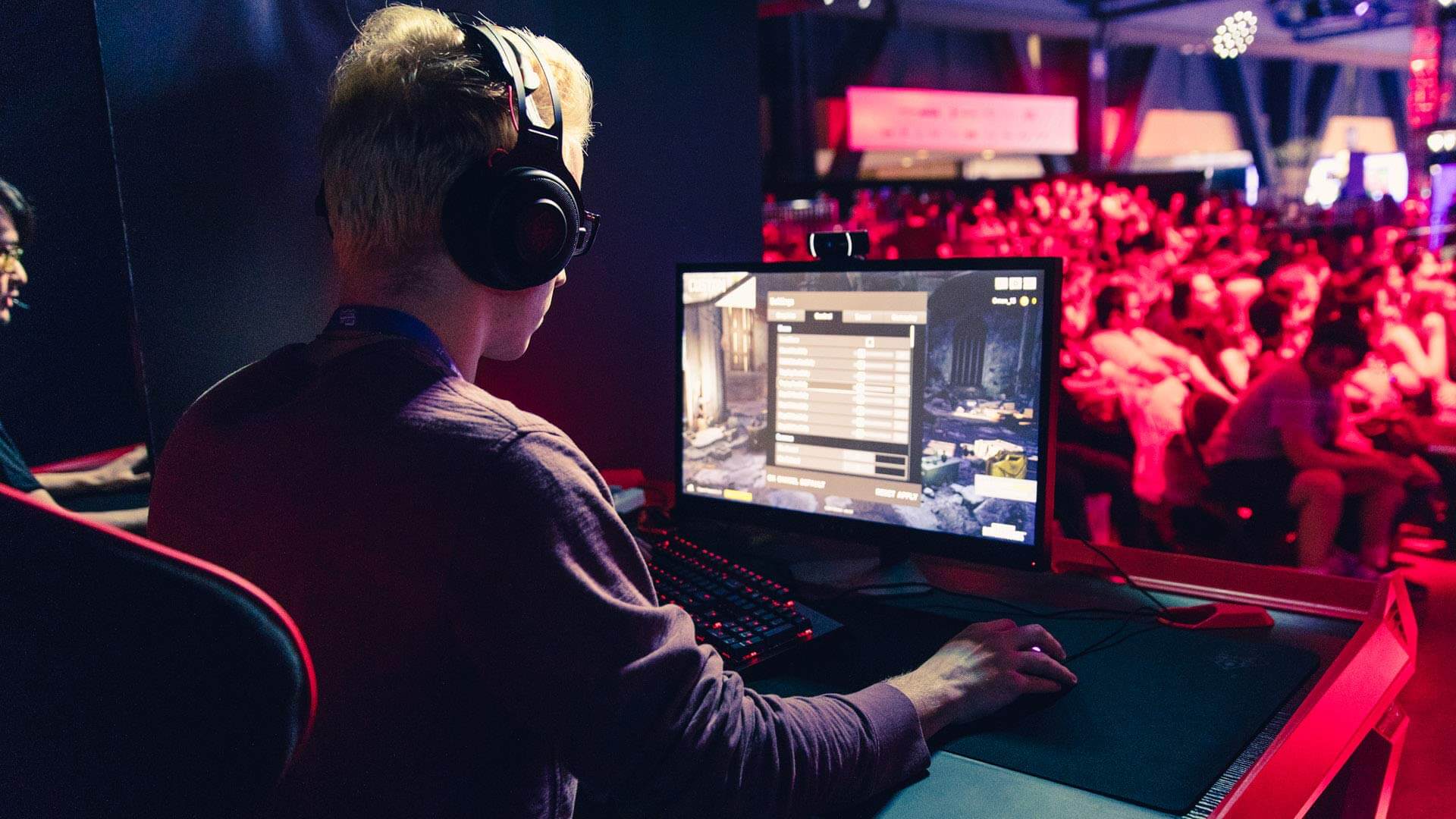 A gamer posing as part of a Prime Gaming banner