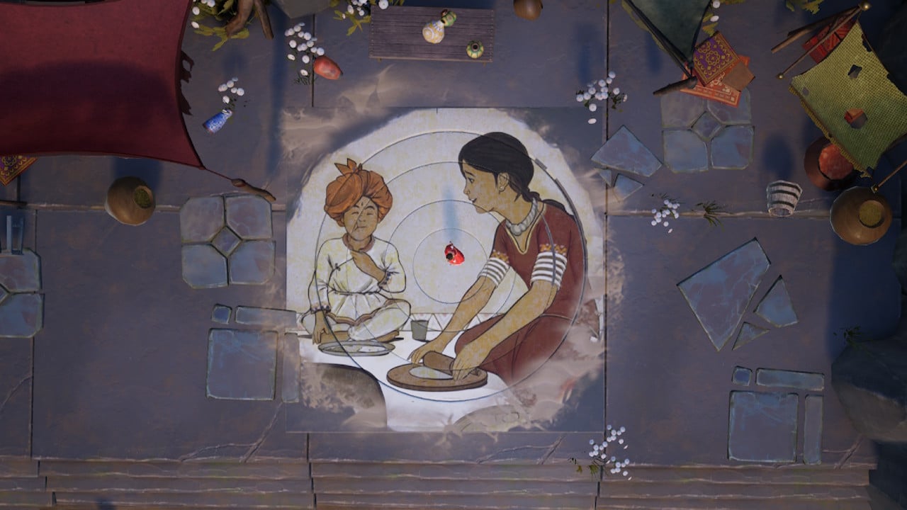 An image of Raji and her brother Golu drawn into the floor in a mandala