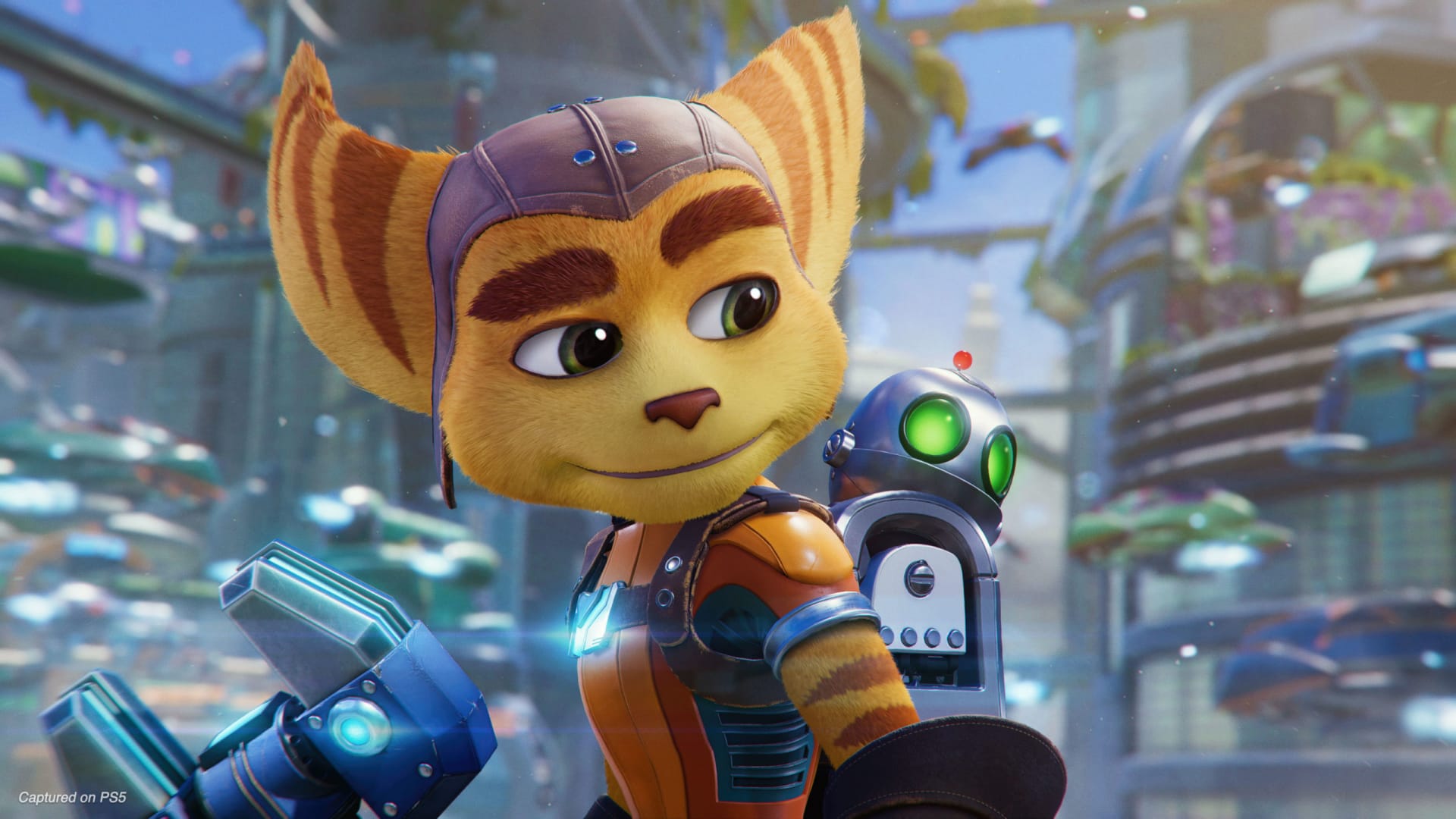 RATCHET in ratchet & clank: rift apart looking at the camera with the iconic orange striped fur and weapon in hand 