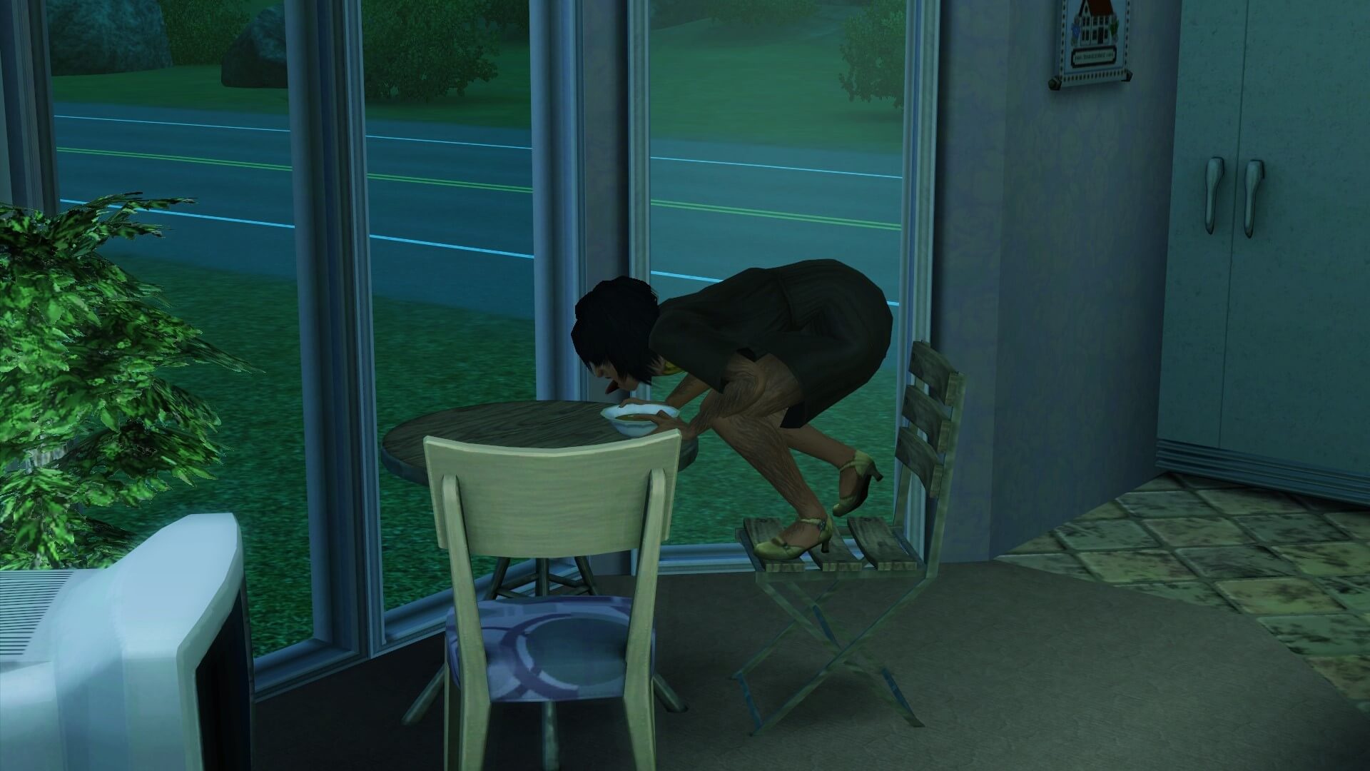 A female Sim sits crouched on a chair, face in her bowl as she eats without manners.
