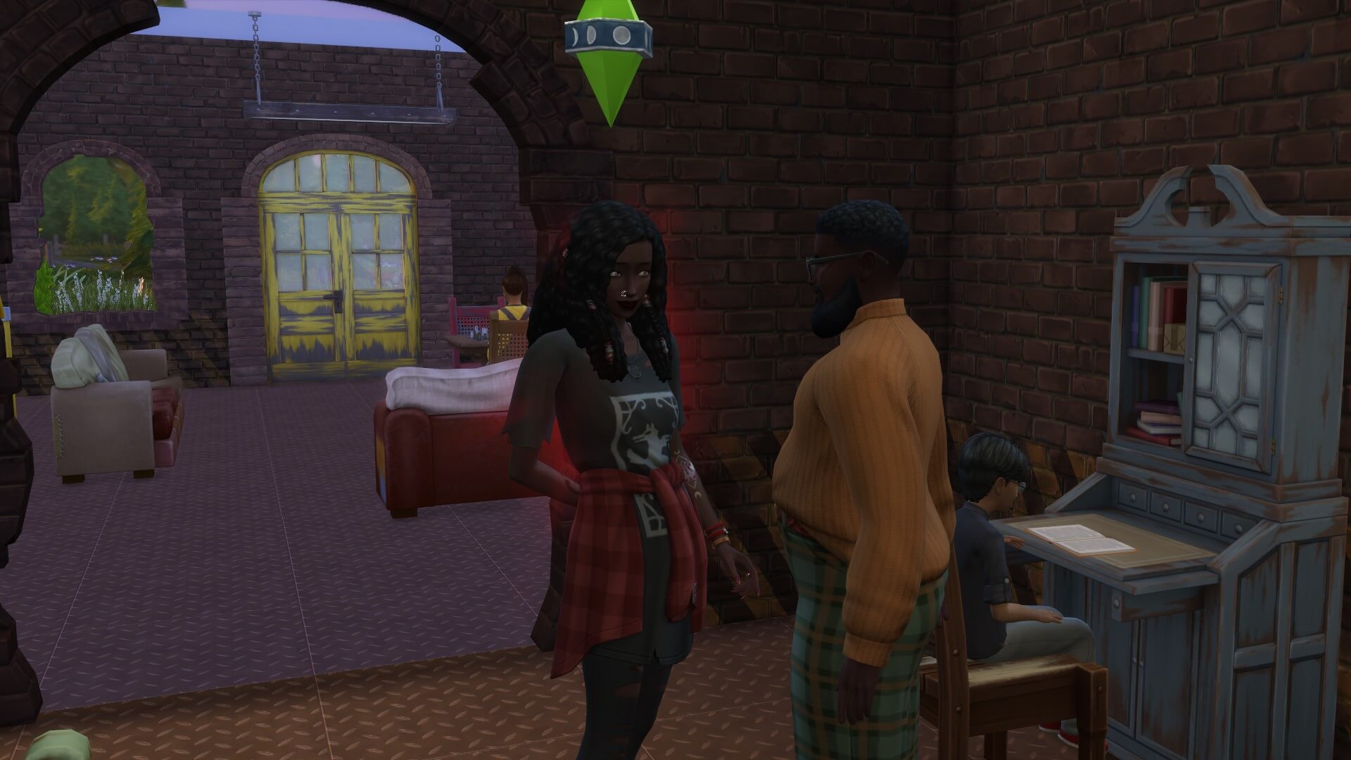 Two Sims stand talking in the Moonwood Mill library.