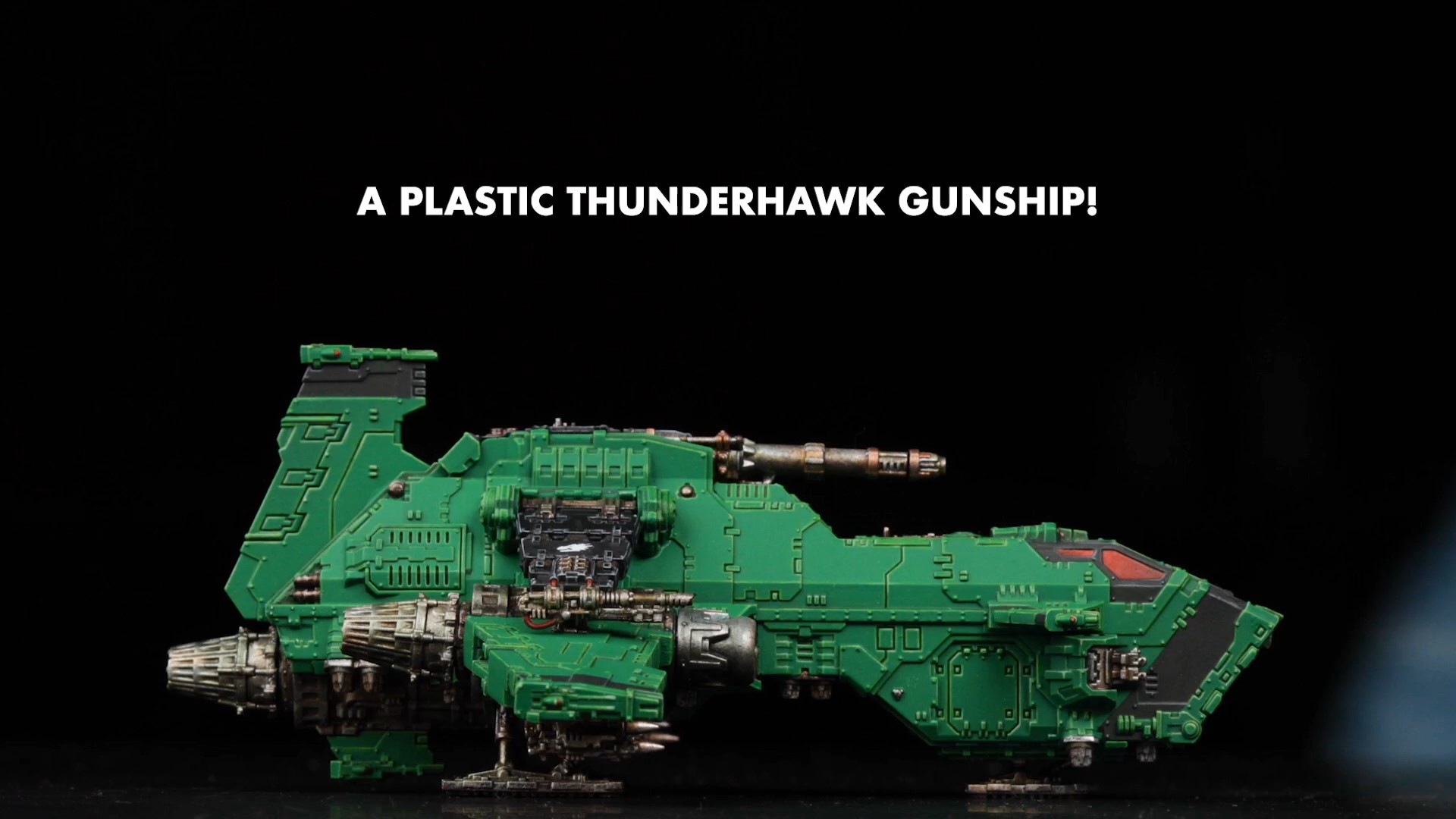 A Thunderhawk Gunship model shown on a black background with white happy text identifying it