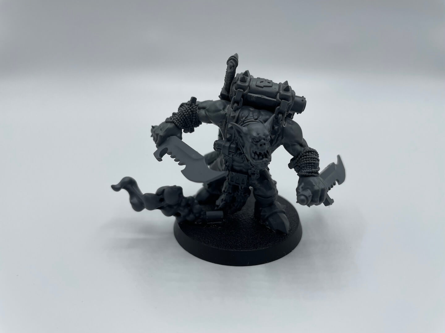 An image of Warhammer 40K Boarding Patrol unit Boss Snikrot, a sneaky Ork with a gun and blade