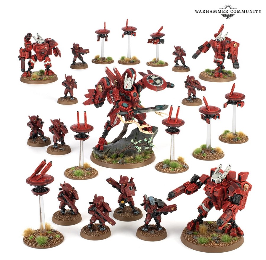 Several Tau miniatures, all painted in red and black, featured in Arks of Omen: Farsight