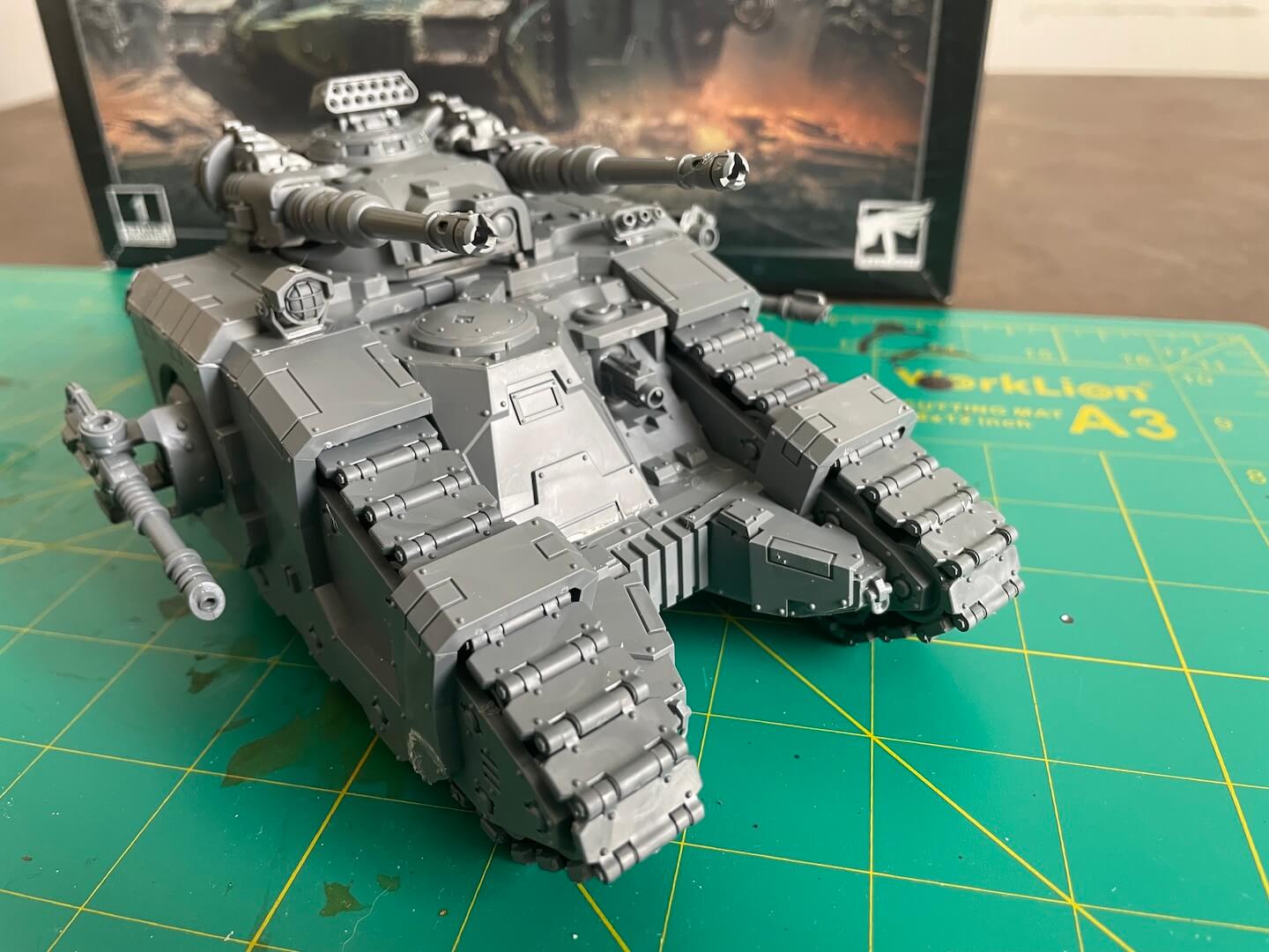 The Warhammer Horus Heresy Sicaran Battle Tank Facing to the right, with all cannons ready to fire