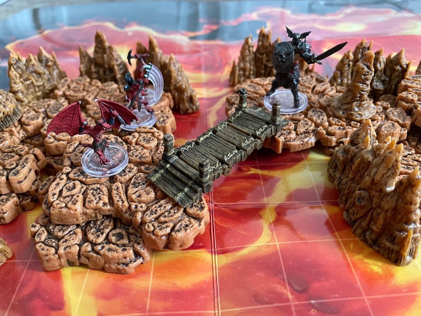 Our valiant fighter stares down a Kobold in a molten cavern created with WizKids WarLock Dungeon Tiles.