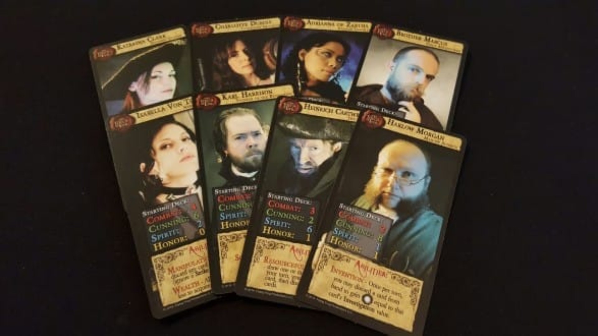 Dark Gothic photo showing 8 different characters cards each with a photogragh of the character in question as well as various stats