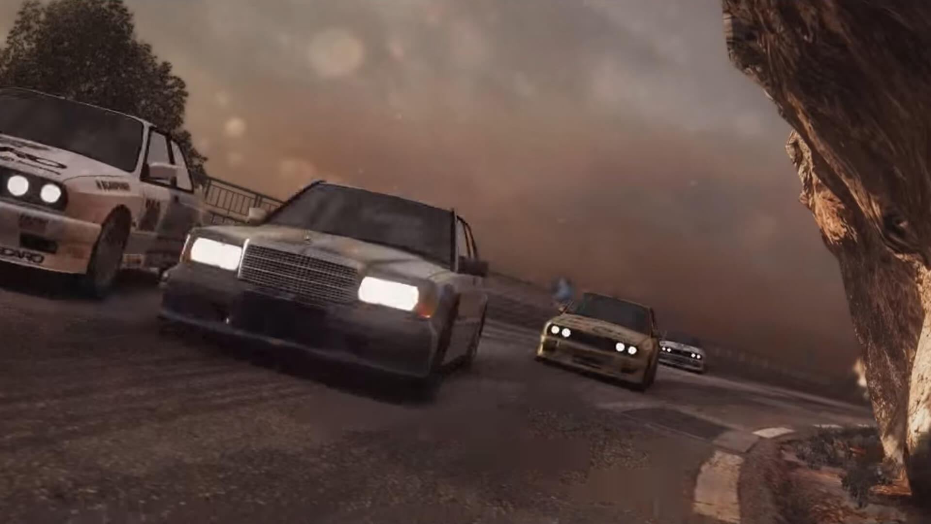 Cars racing around a bend in GRID 2, a PS Plus Instant Collection game in 2013