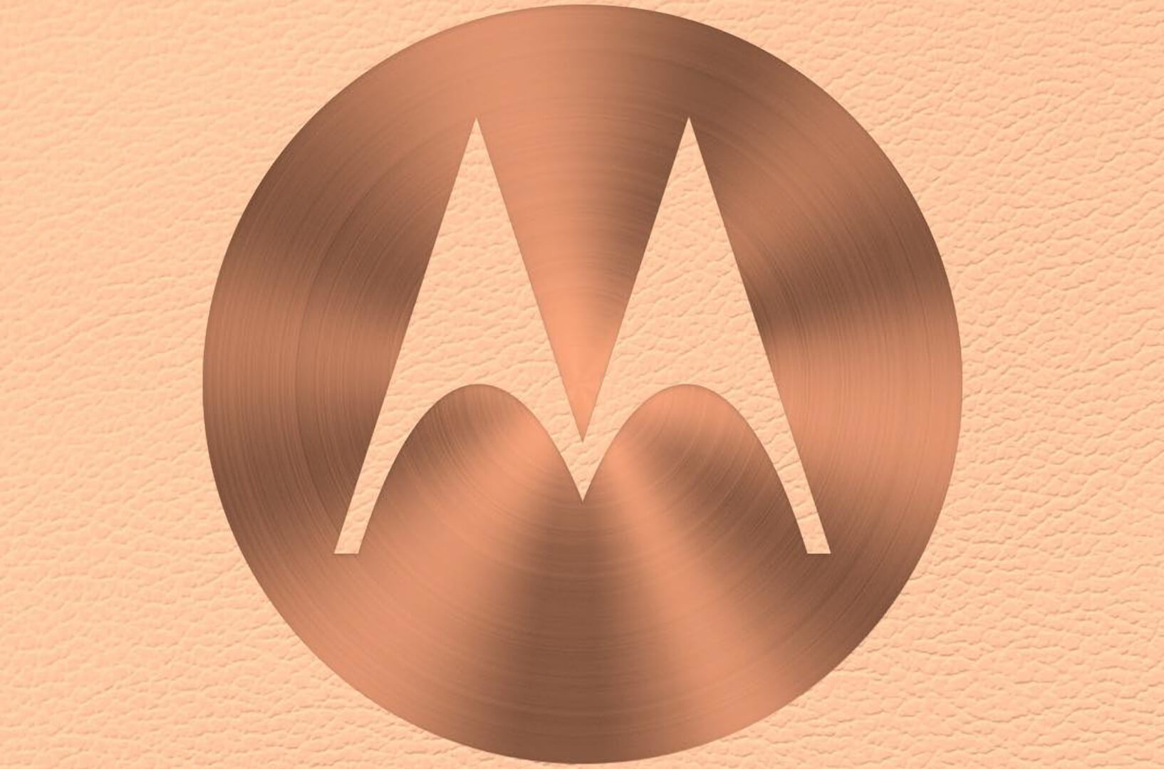 A bronze Motorola logo against a textured background